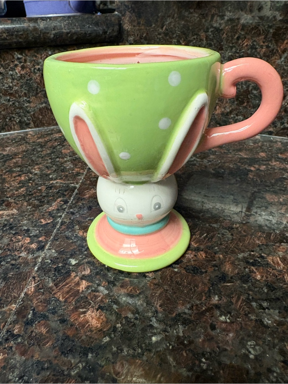 Handmade upcycled candle bunny mug with rose scented wax and rose petals on top